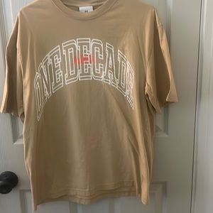 Tan graphic t-shirt from H&M. Size Medium.